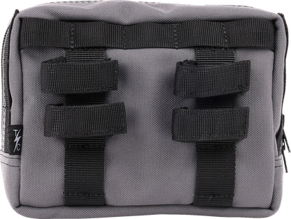 Gray handlebar bag by THRASHIN SUPPLY CO. with adjustable straps and compact design, suitable for bike storage.
