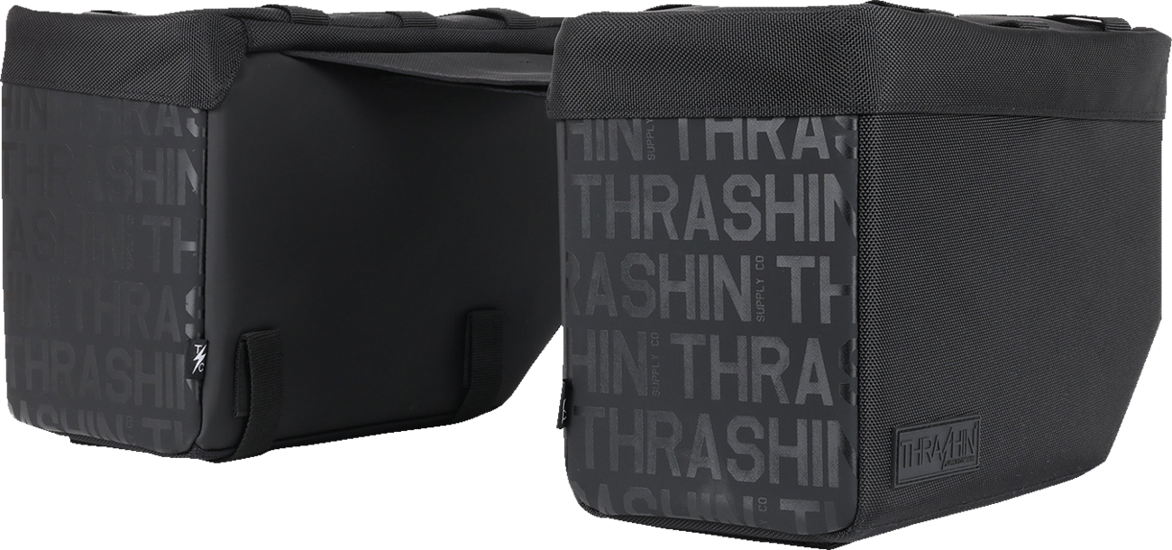Black leather motorcycle saddlebags from THRASHIN SUPPLY CO., 10-liter capacity with sturdy straps and metal buckles.