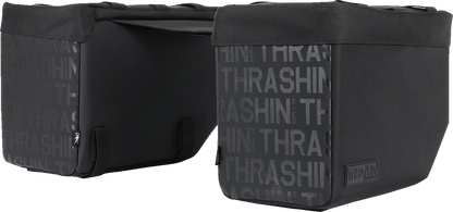 Black leather motorcycle saddlebags from THRASHIN SUPPLY CO., 10-liter capacity with sturdy straps and metal buckles.