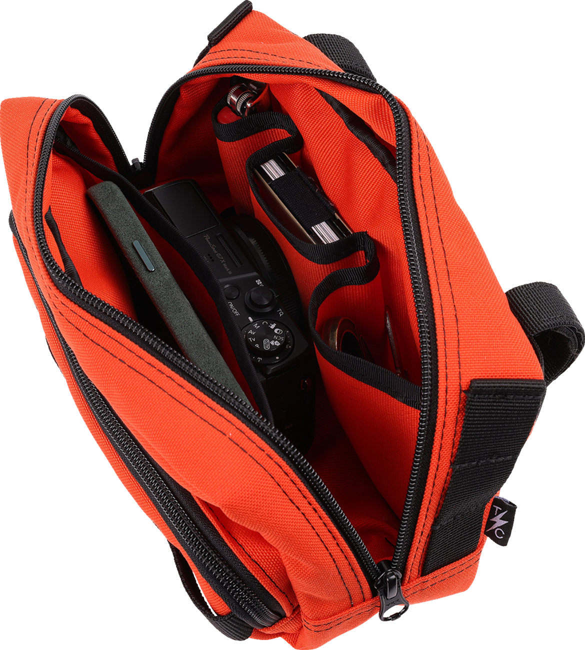 Orange THRASHIN SUPPLY CO. Handlebar Bag Plus mounted on a bicycle handlebar, featuring durable material and secure attachment.