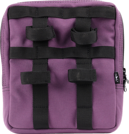 Purple THRASHIN SUPPLY CO. Handlebar Bag Slim attached to a bicycle handlebar, showcasing its compact design and secure strap system.