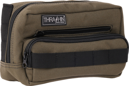 Green THRASHIN SUPPLY CO. Handlebar Bag Plus mounted on a bicycle handlebar, with straps and zipper closure visible in the image.