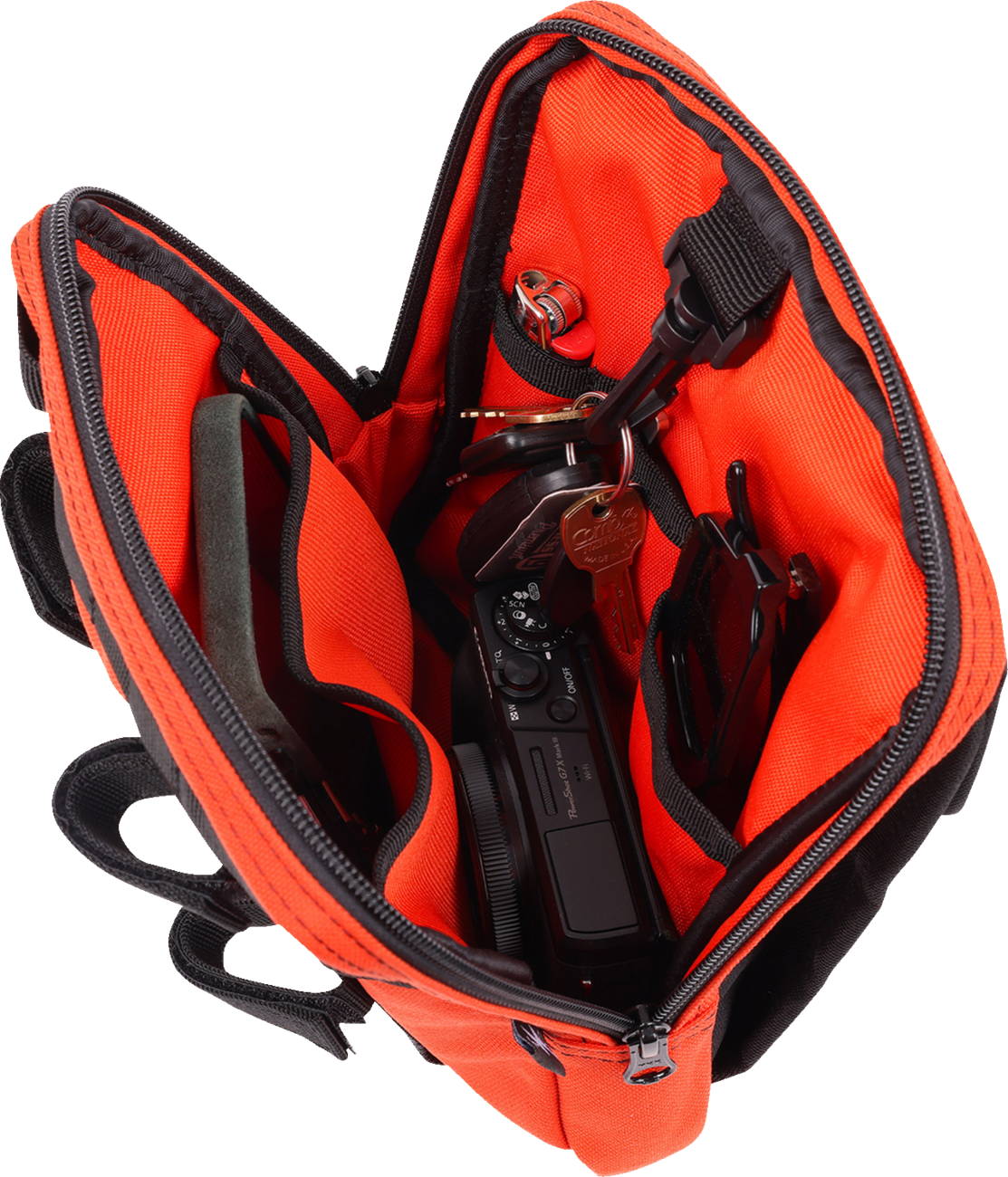 Orange THRASHIN SUPPLY CO. Handlebar Bag Slim with adjustable straps and compact design for cycling storage.