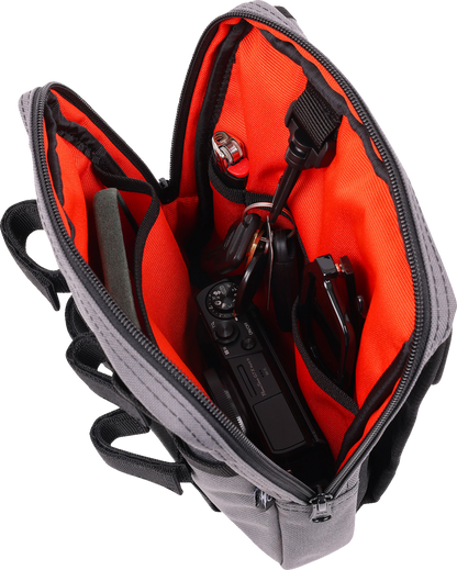 Gray THRASHIN SUPPLY CO. Handlebar Bag Slim mounted on a bicycle handlebar, showcasing its compact design and durable material.