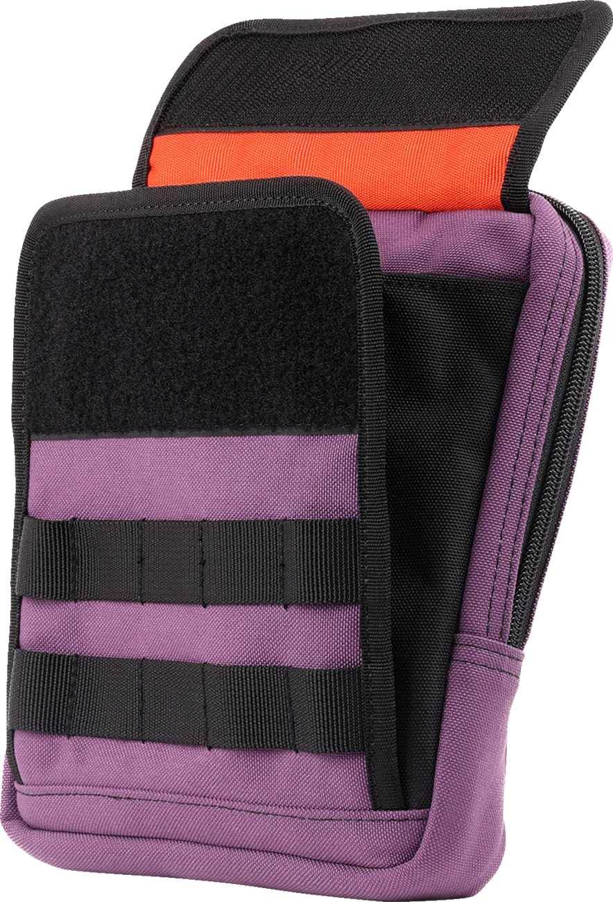 Purple THRASHIN SUPPLY CO. Handlebar Bag Slim attached to a bicycle handlebar, showcasing its compact design and secure strap system.