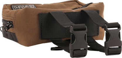 Brown THRASHIN SUPPLY CO. handlebar bag with MOLLE webbing and multiple attachment points for bikes and cycling gear.