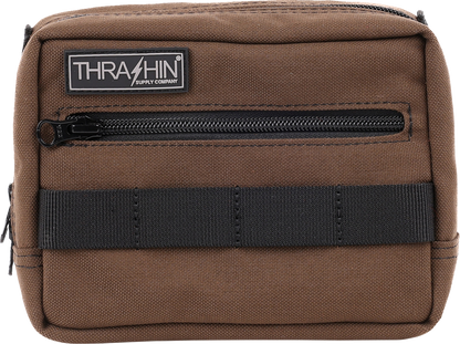Brown THRASHIN SUPPLY CO. handlebar bag with MOLLE webbing and multiple attachment points for bicycles.