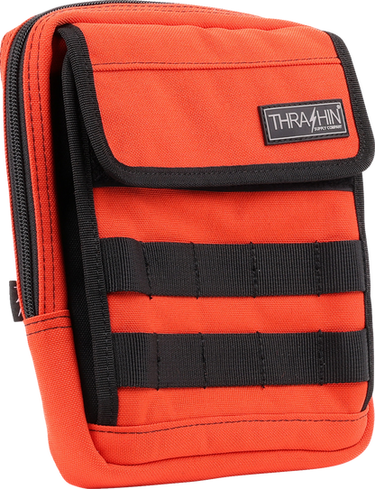 Orange THRASHIN SUPPLY CO. Handlebar Bag Slim (THB-0035) attached to a bicycle handlebar, showcasing its compact design and vibrant color.
