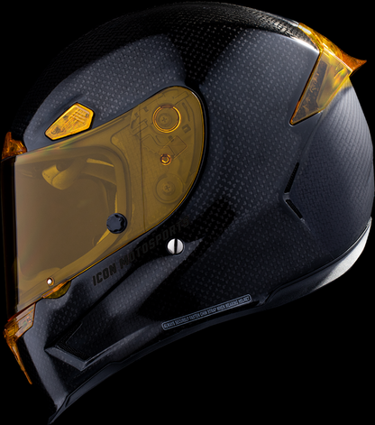Yellow ICON Airframe Pro™ helmet in carbon finish, size XS, featuring aerodynamic design and clear visor, by Bill's Exhausts.