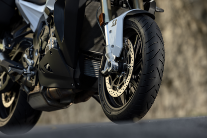 BRIDGESTONE T33 front motorcycle tire with 120/70R19 size and 60V speed rating, featuring tread pattern and sidewall details.