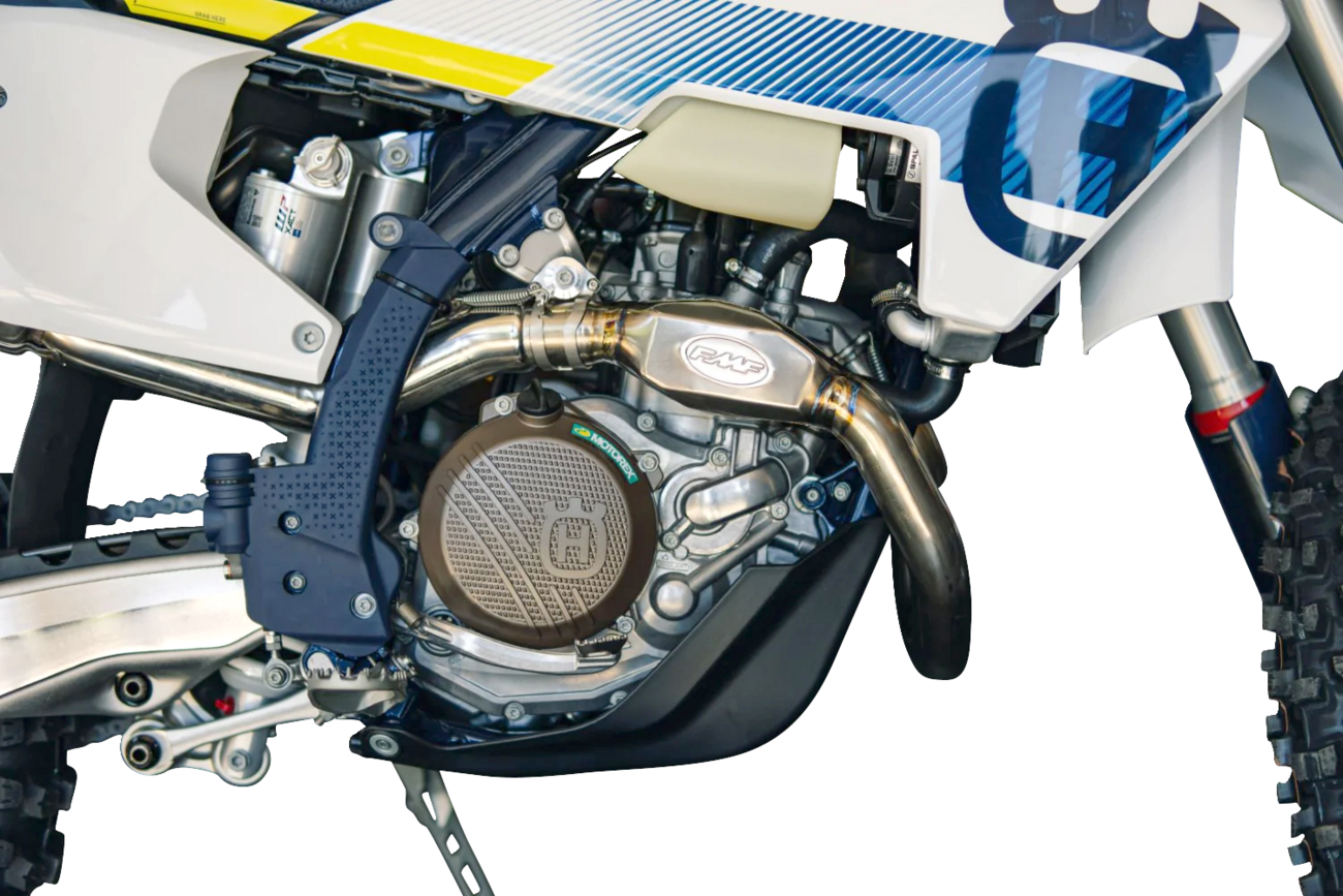 FMF MegaBomb titanium header for TF 250-X dirt bike, showing shiny titanium finish and sleek design.