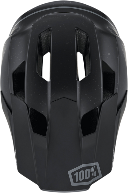 Black XL 100% Trajecta bicycle helmet with Fidlock buckle, featuring aerodynamic vents and matte finish.