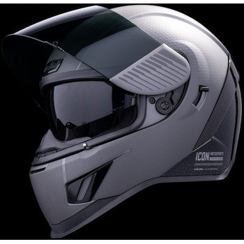 Silver ICON Airform MIPS helmet with Counterstrike design, 2XL size, featuring sleek aerodynamic shape and adjustable strap.