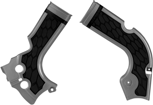 Acerbis X-Grip motorcycle frame guards in silver and black attached to a bike body, providing protection and style.