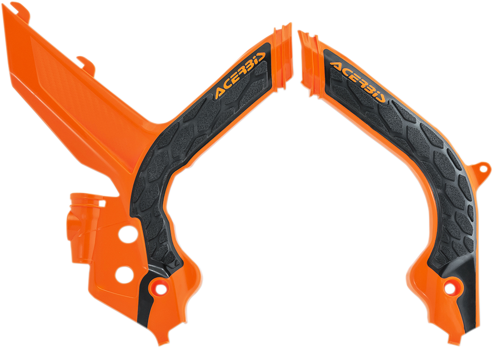 A set of Acerbis X-Grip frame guards in orange and black, designed for motorcycle protection, displayed on a neutral background.
