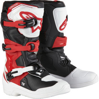 Alpinestars Youth Tech3S motocross boots in white, black, and red with protective features and adjustable straps.