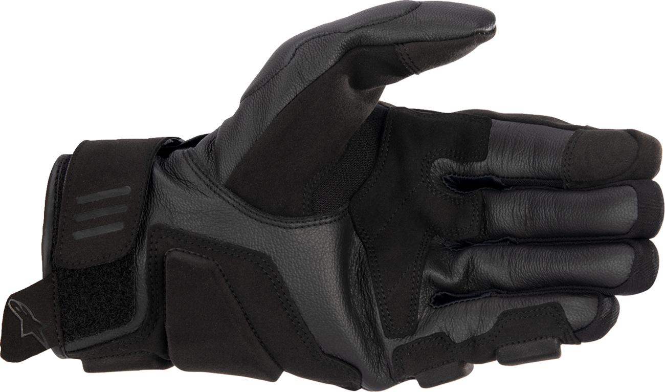 Black and white Alpinestars Phenom motorcycle gloves in 2XL size, featuring reinforced knuckles and adjustable wrist straps.