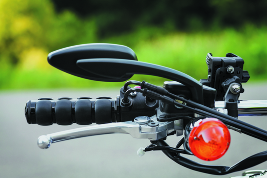Kuryakyn mirror adapter for Triumph and Harley-Davidson motorcycles, shown in black with mounting hardware.