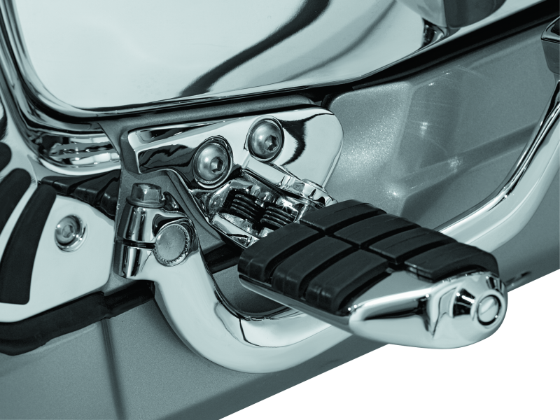 Kuryakyn driver peg mounts in chrome for Honda Gold Wing GL1800 and F6B motorcycle, showing shiny metal brackets and mounting hardware.