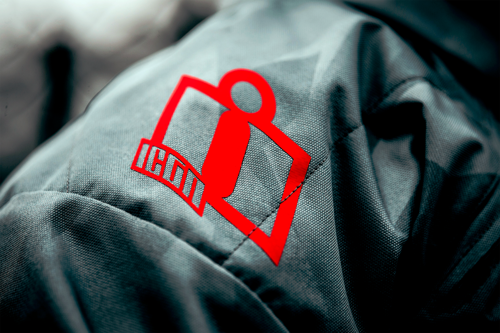 Gray ICON Airform Battlescar™ jacket in 4XL size with armored panels, featuring a rugged design and textured fabric details.