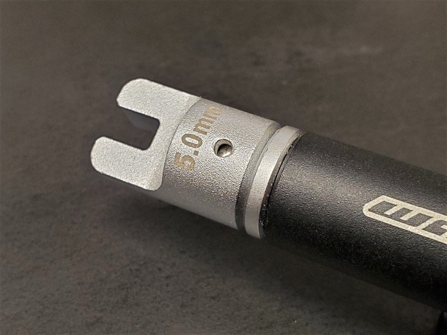 Warp9Racing 5.0mm spoke wrench tip for bike wheel adjustments, shown with a close-up of the tool tip in black finish.