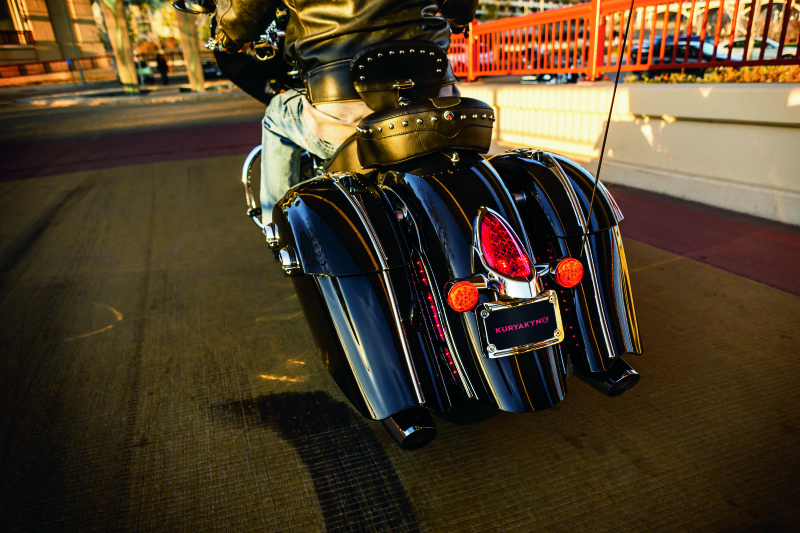 Kuryakyn LED curved license plate frame for Indian motorcycles with chrome finish, featuring integrated LED lighting.