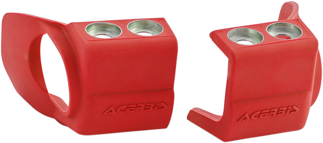 Acerbis red shoe protectors for inverted motorcycle forks, designed to shield forks from dirt and damage, shown on a motorcycle suspension.