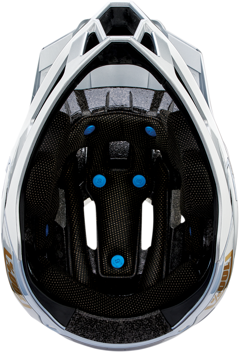 Silver 100% Trajecta bicycle helmet with Fidlock closure in large size, shown from the front with adjustable straps.