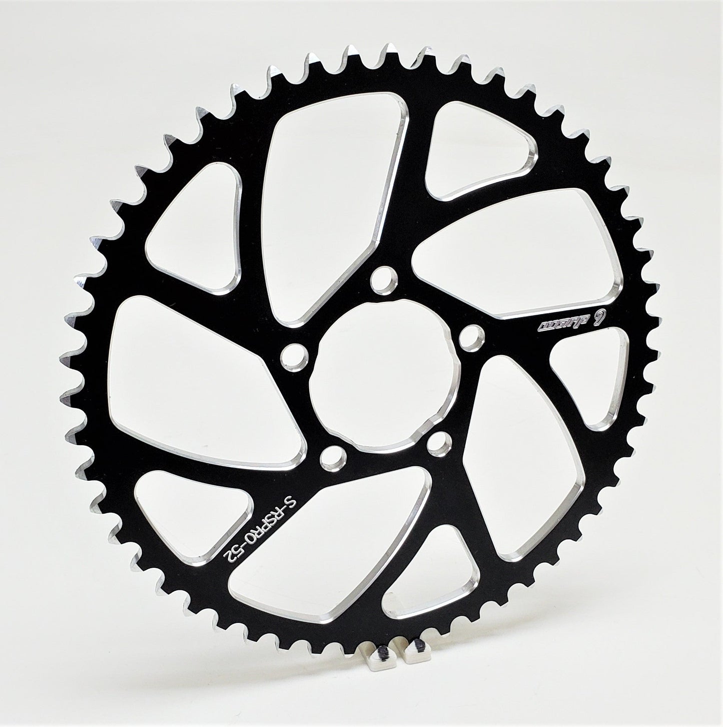 Warp 9 Racing E-Moto rear sprocket with 52 teeth, made of aluminum and stainless steel, designed for Surron, Talaria, and more.