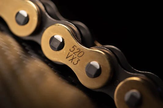 Warp9Racing DID VX3 520 chain displaying the silver metal links and branding for high-performance motorcycle chain.