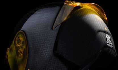 Yellow Icon Airframe Pro carbon motorcycle helmet with large size, featuring aerodynamic design and venting system.