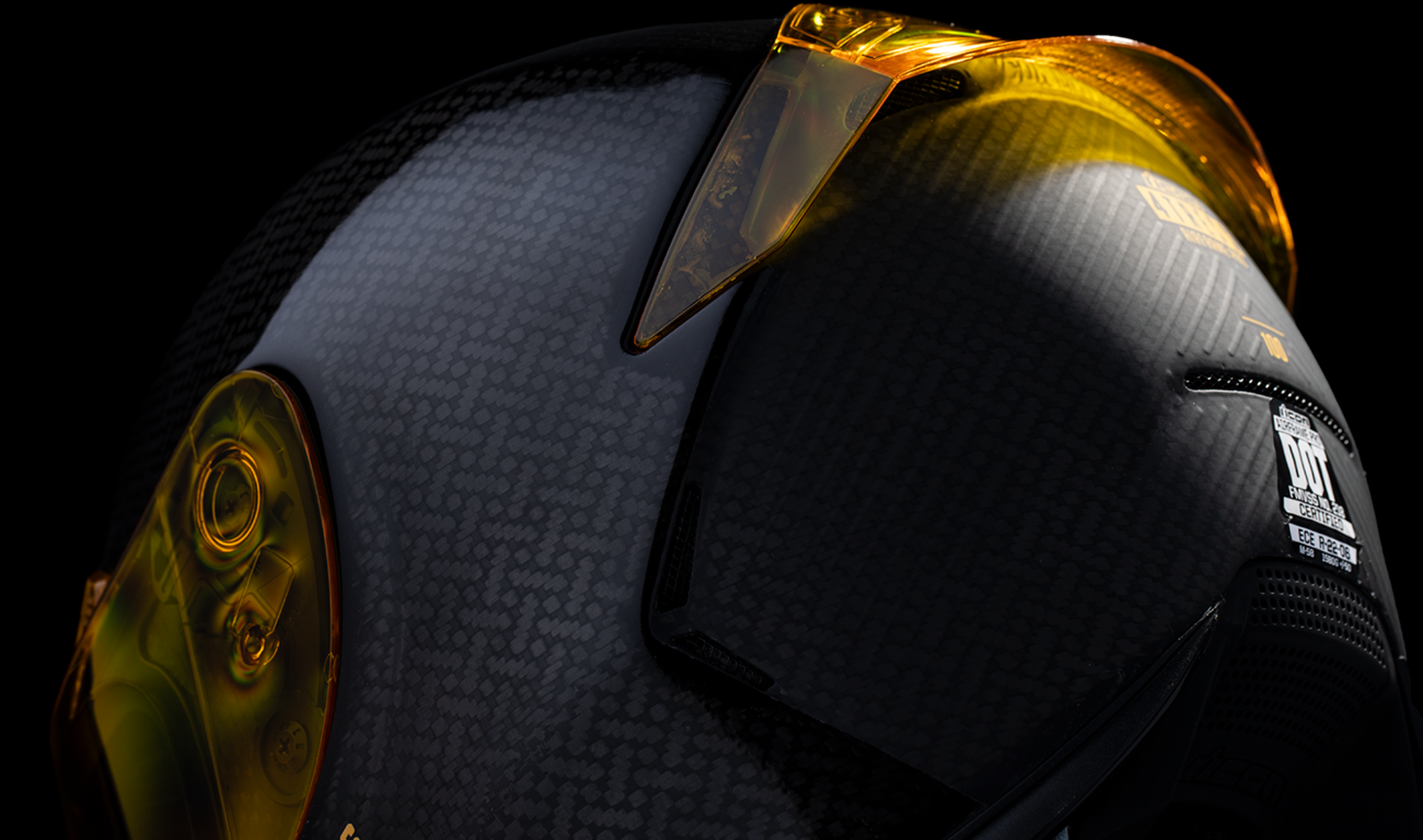 Yellow ICON Airframe Pro™ helmet in medium size with carbon shell and 4Tress design, featuring sleek aerodynamic shape.