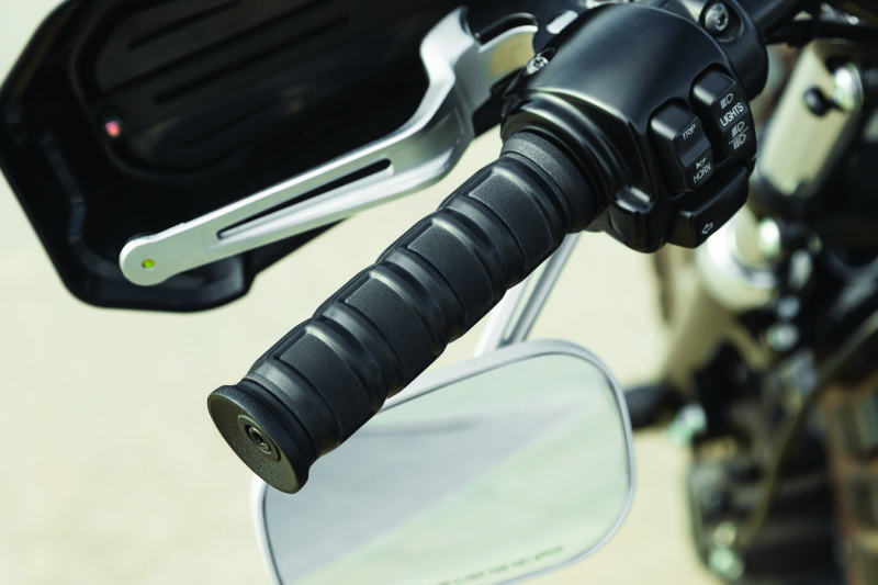 Kuryakyn Dillinger grips with dual cables in satin black for motorcycle handlebars, showcasing textured rubber and chrome accents.