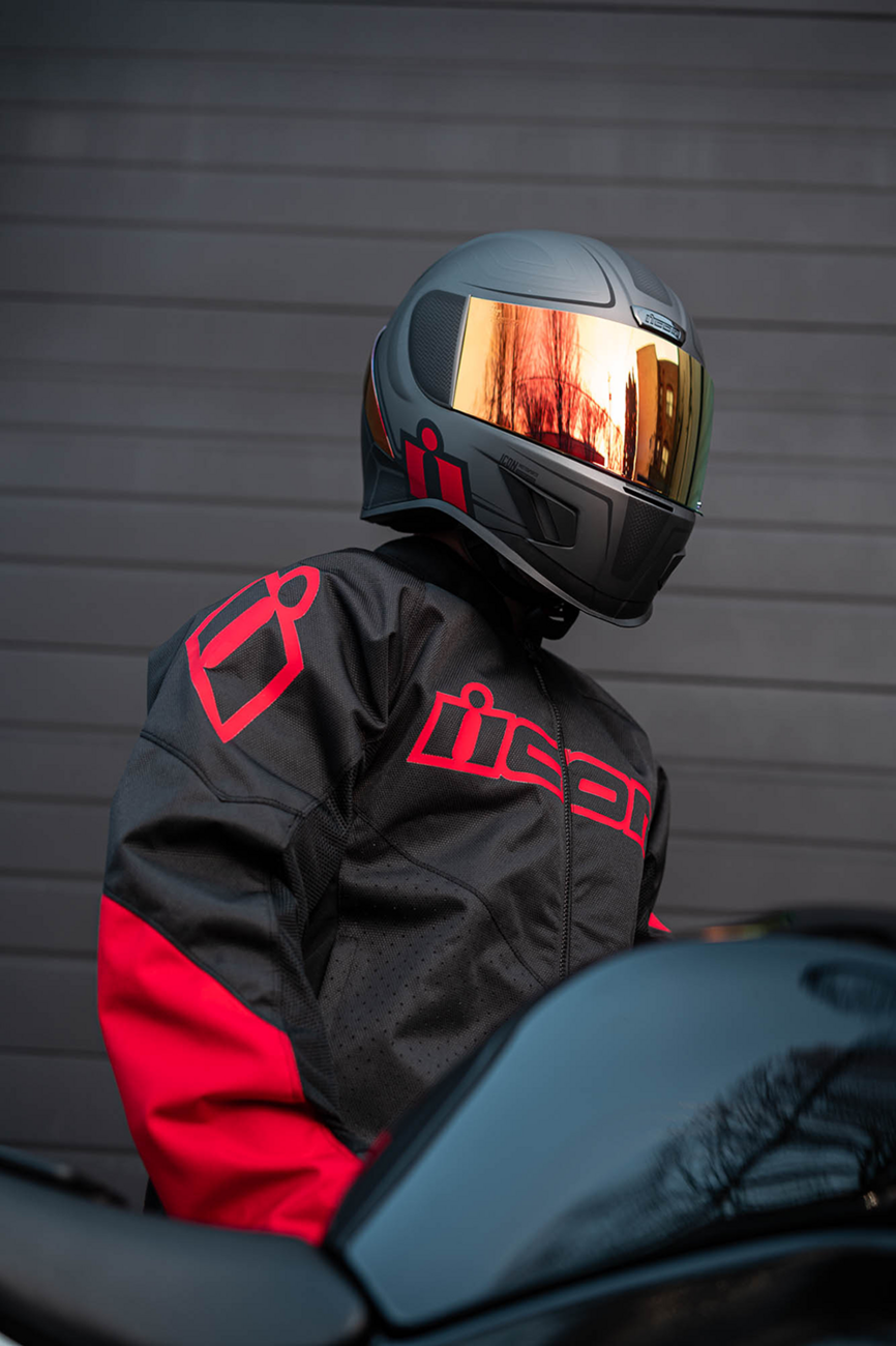 ICON Airform™ Helmet Resurgent red XS with sleek aerodynamic design and clear visor, featuring bold graphics and ventilation vents.