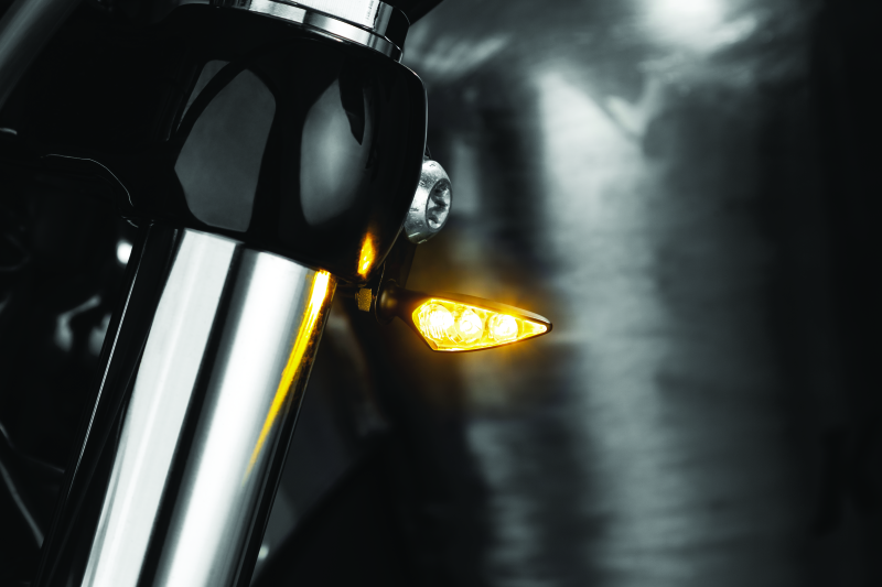 Kuryakyn Rhombus S single function front left amber turn signal with clear lens on a motorcycle
