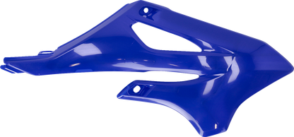 Blue ACERBIS radiator shrouds for motorcycle body, featuring sleek design and vibrant blue color.