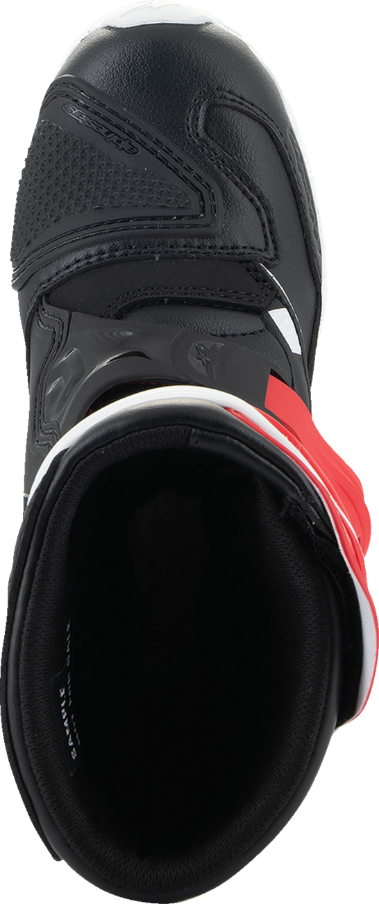Alpinestars Kids Tech 3S motorcycle boots in red, black, and white with adjustable straps and protective features.