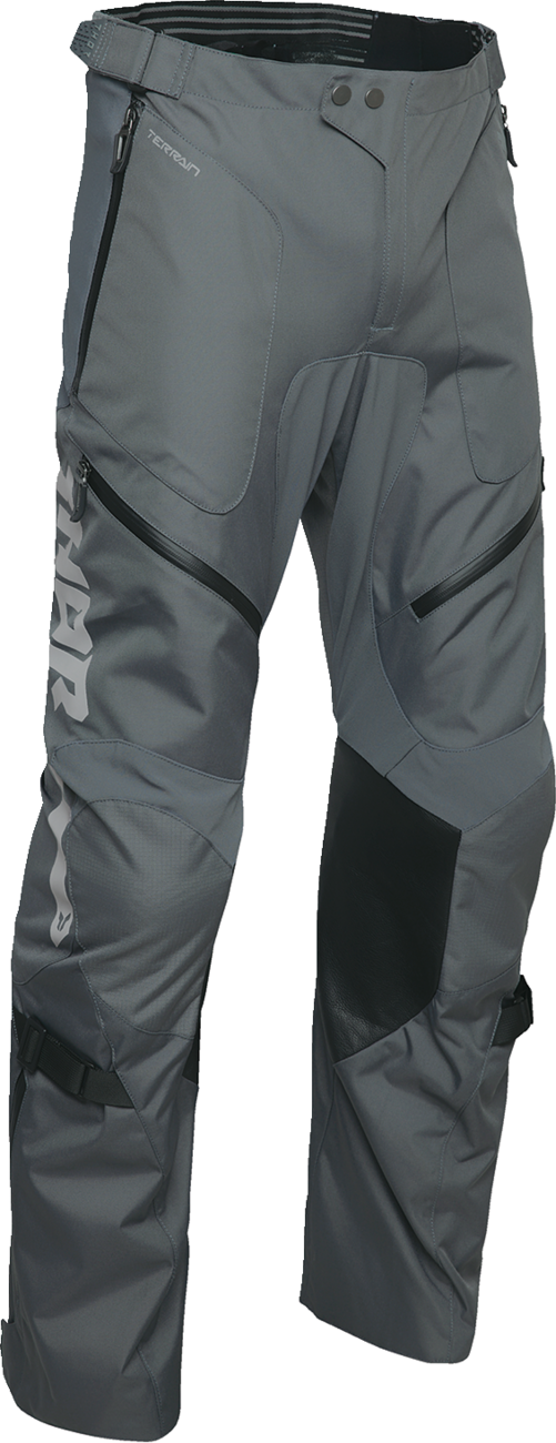 Black THOR Terrain over-the-boot motorcycle pants in charcoal color, US size 40 with reinforced knee panels.