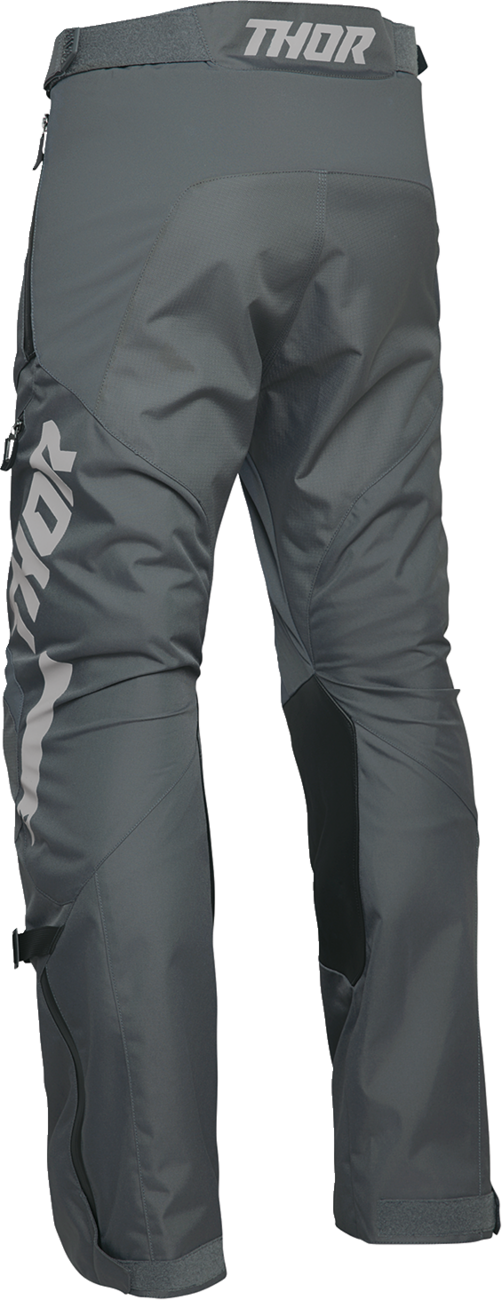 THOR Terrain over-the-boot pants in charcoal, US size 34, featuring durable fabric and rugged outdoor design.