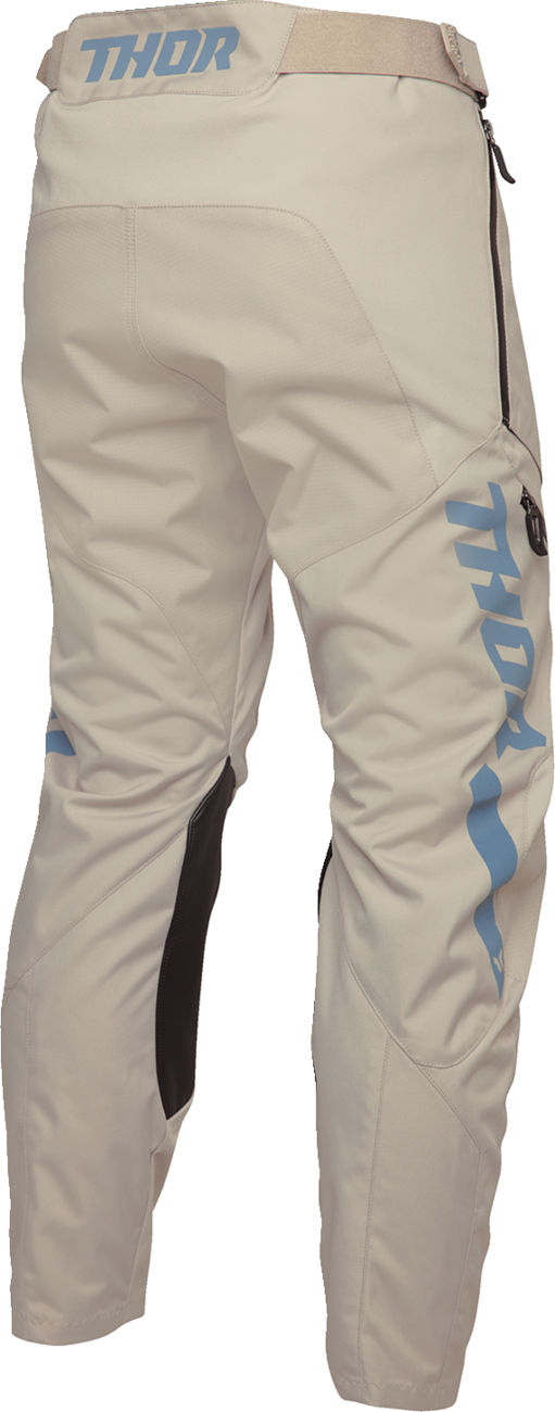 THOR Terrain In-the-Boot Pants in sand color, US size 44, with durable fabric and reinforced knee panels for riding comfort.
