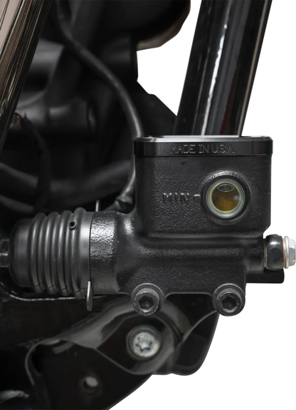 Black rear brake reservoir cap for '18+ Softail by THRASHIN SUPPLY CO., designed for easy installation and durability.