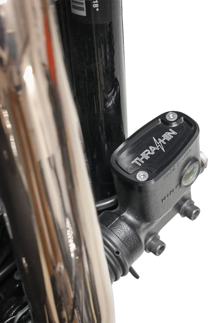Black rear brake reservoir cap for '18+ Softail, designed by THRASHIN SUPPLY CO., with twice cut detail for enhanced style.