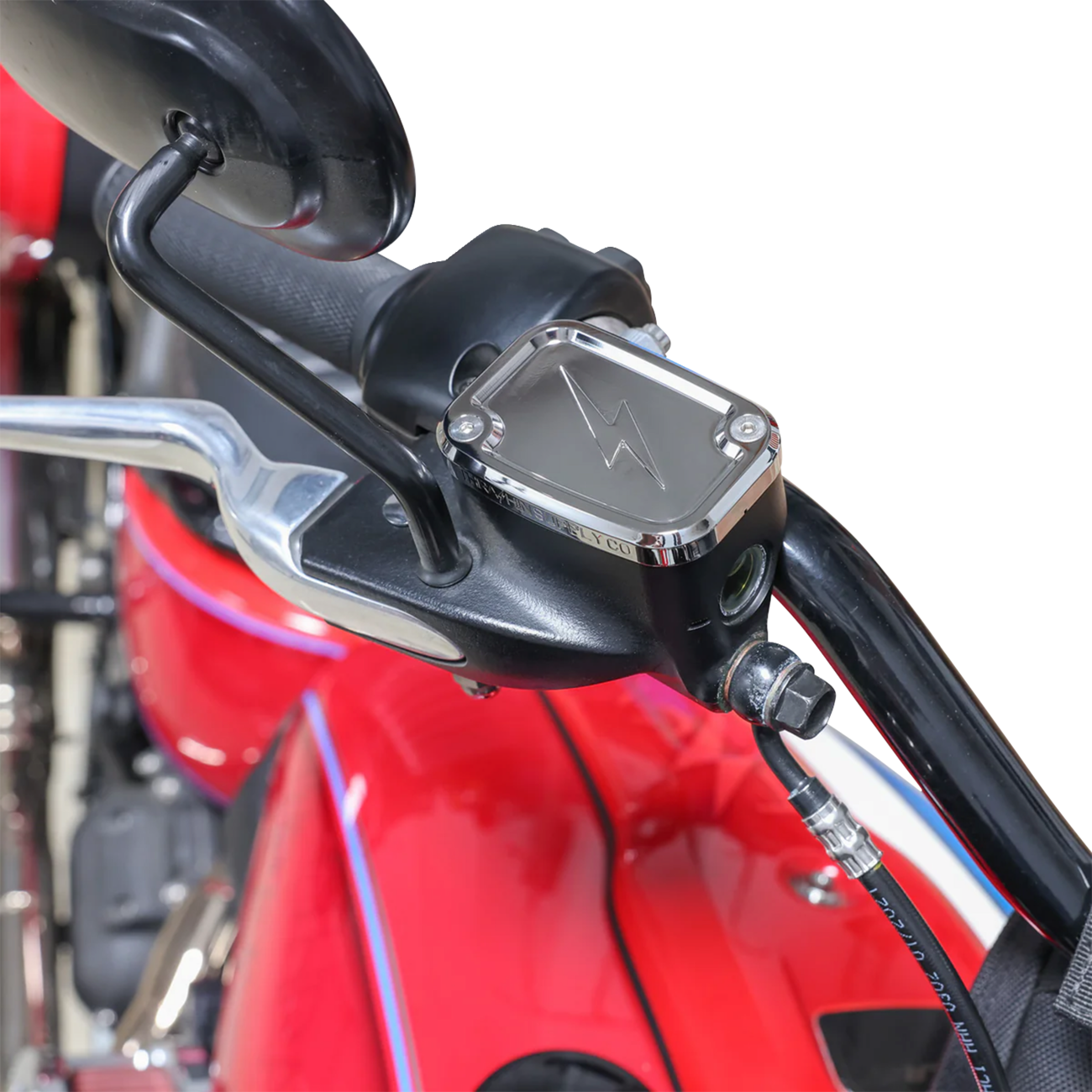 Chrome front brake master cylinder cover for motorcycle by THRASHIN SUPPLY CO., with engraved branding and sleek finish.