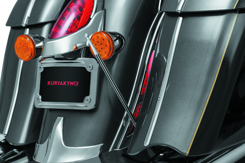 Kuryakyn antenna adapter for Indian and Victory motorcycles, part 869, shown attached to motorcycle antenna connection.