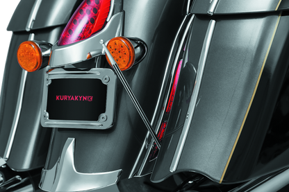 Kuryakyn antenna adapter for Indian and Victory motorcycles, part 869, shown attached to motorcycle antenna connection.