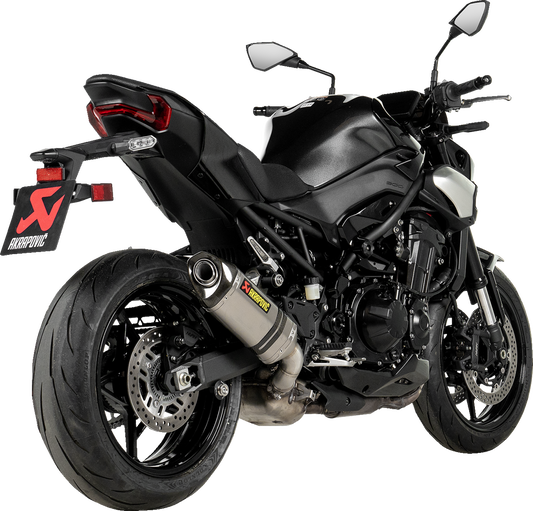 AKRAPOVIC titanium slip-on muffler for Kawasaki Z900 motorcycle, showcasing sleek exhaust design and branding.