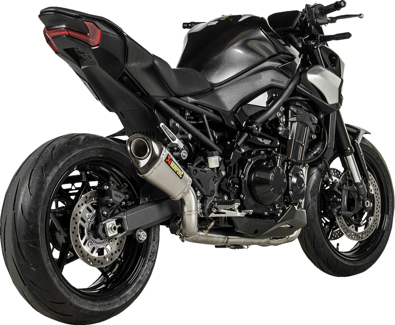 AKRAPOVIC Slip-On Line Muffler for Kawasaki Z900 titanium race exhaust, showing the sleek muffler with branding details.