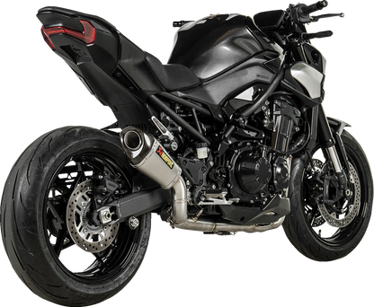 AKRAPOVIC Slip-On Line Muffler for Kawasaki Z900 titanium race exhaust, showing the sleek muffler with branding details.