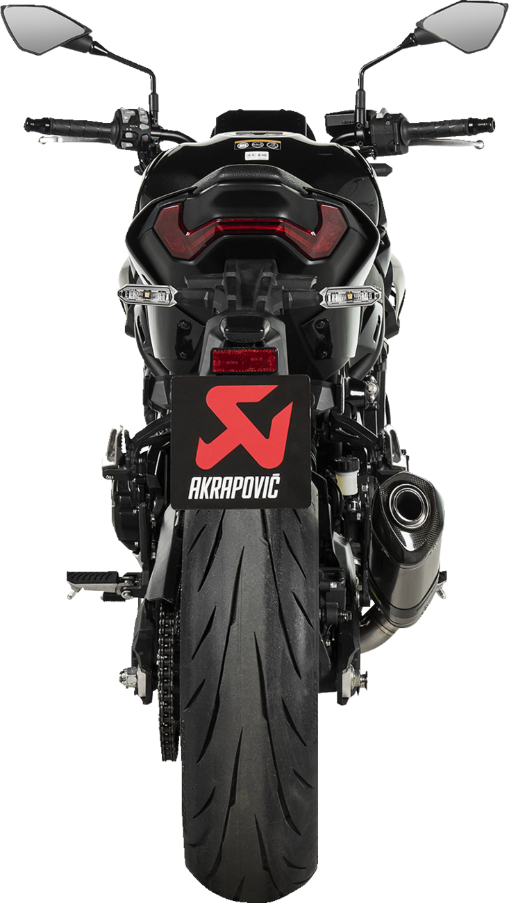 AKRAPOVIC slip-on muffler for Kawasaki Z900 motorcycle in titanium finish, showcasing sleek design and polished surface.