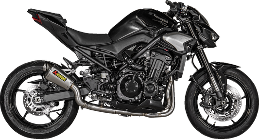 AKRAPOVIC titanium slip-on exhaust muffler for Kawasaki Z900 motorcycle, racing style with sleek titanium finish.